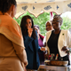 Meghan, Duchess of Sussex (C) jokes with her mother Doria Ragland (L) at an event to mark the launch of a cookbook with recipes from a group of women affected by the Grenfell Tower fire on Sept. 20, 2018 in London, England.